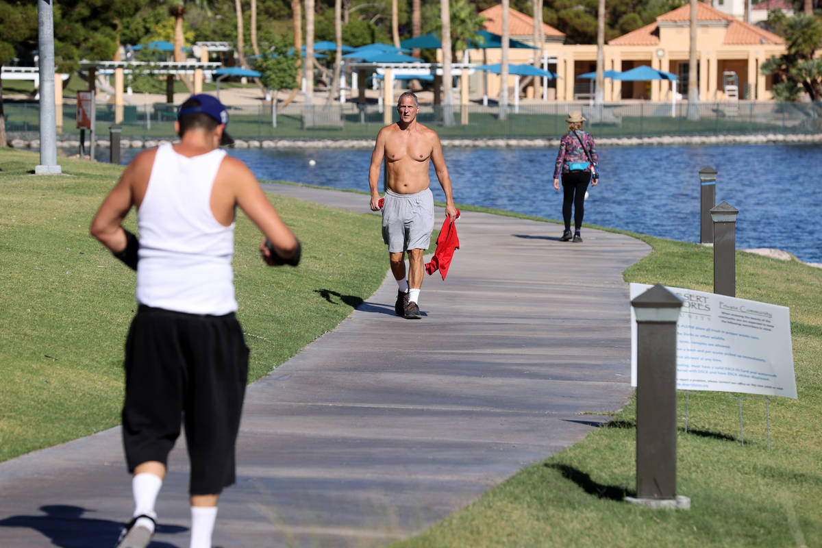 Anthony Camou, left, and Phil Frehley, both of Las Vegas exercise at Desert Shores in Las Vegas ...