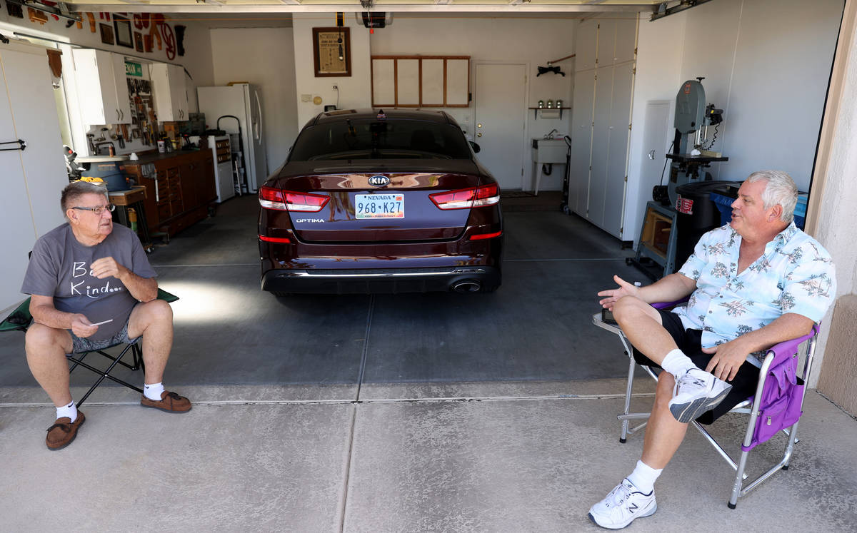 Neighbors Jerry Venneman, 80, left, and Alvin Blott, 63, enjoy cooler weather at Sun City Summe ...