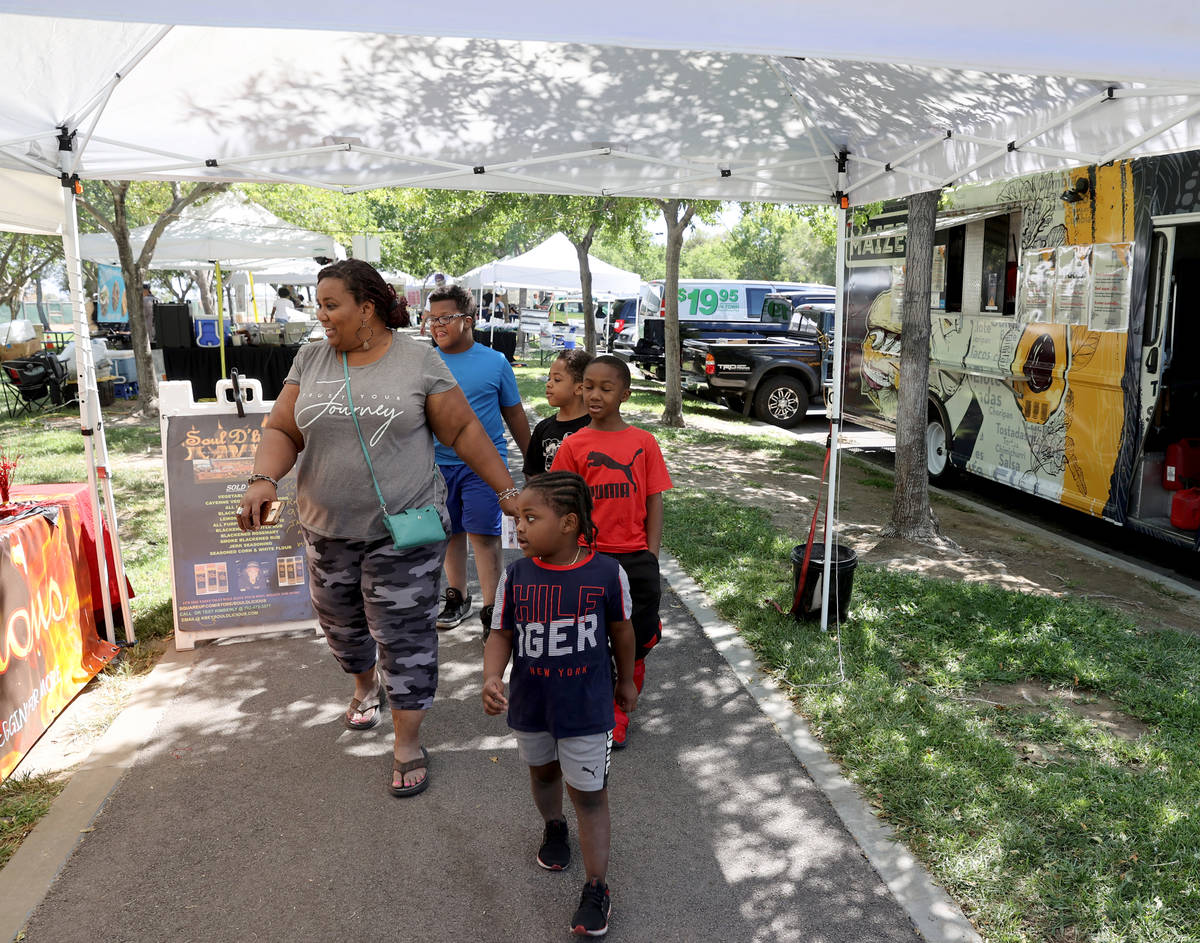 Wanda Good of Cleveland shops with her nephews, from left, Ean Good, 10, Liam Carothers, 4, Eth ...