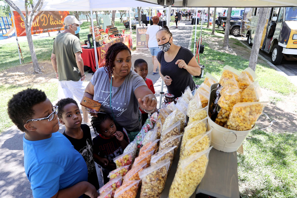 Wanda Good of Cleveland shops with her nephews, from left, Ean Good, 10, Ethan Good, 8, Liam Ca ...