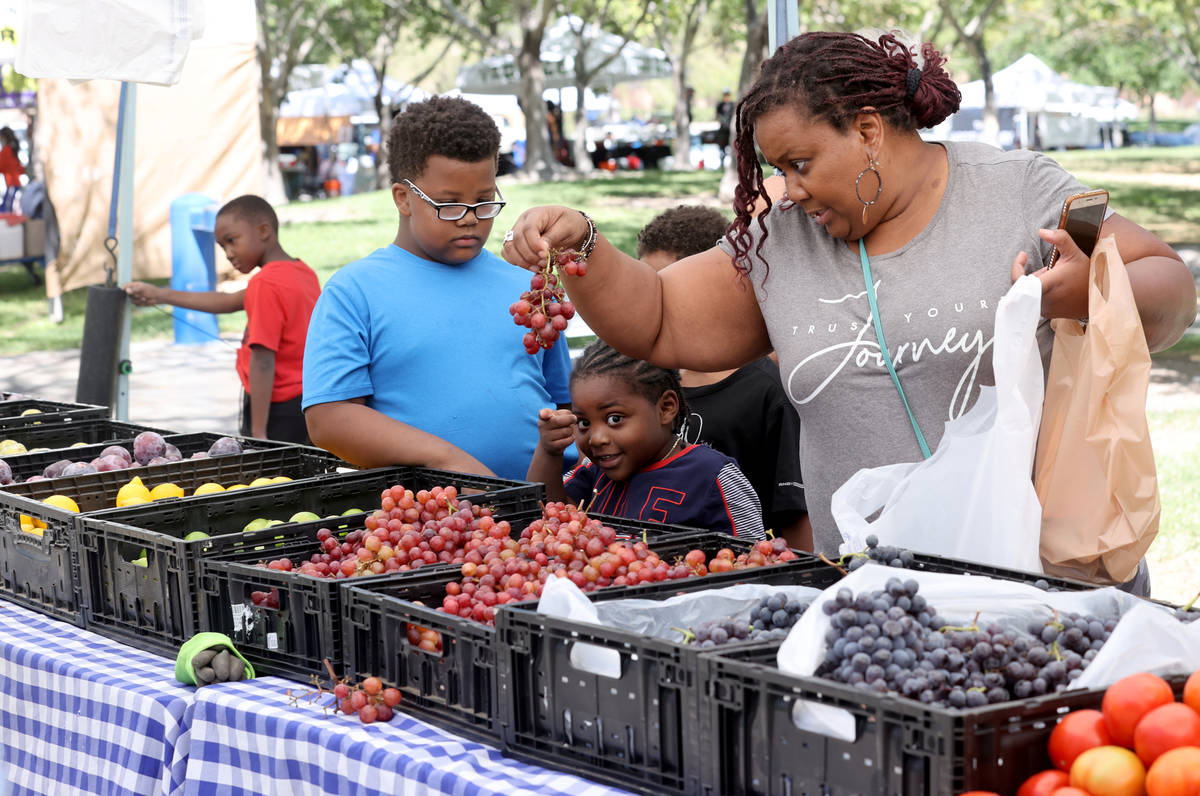 Wanda Good of Cleveland shops with her nephews, from left, Lathan Carothers, 9, Ean Good, 10, L ...