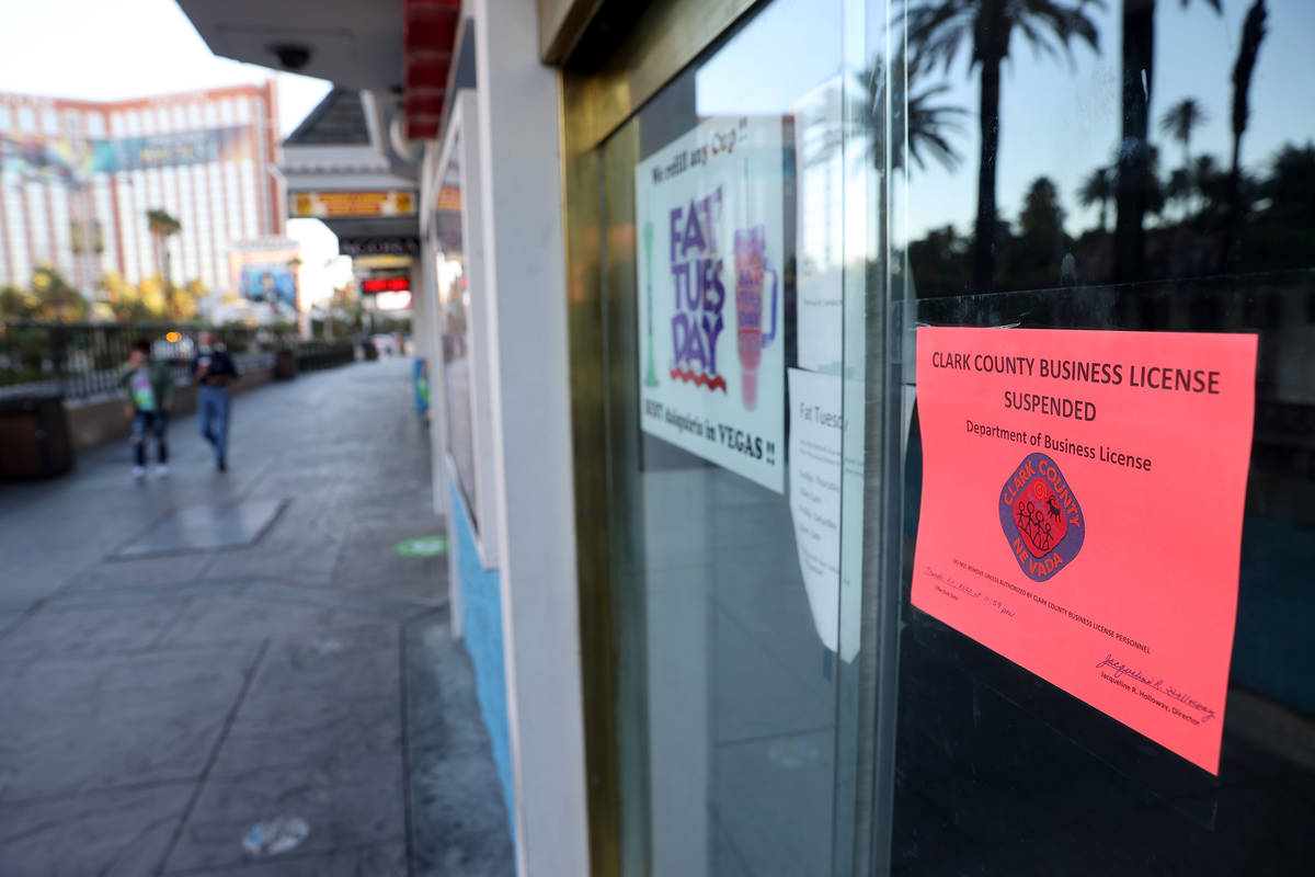 A Clark County sign states that the business license has been suspended at Fat Tuesday at Casin ...