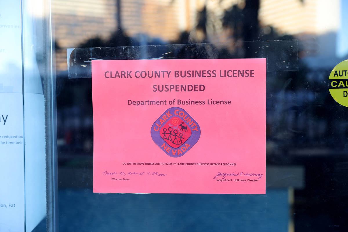 A Clark County sign states that the business license has been suspended at Fat Tuesday at Casin ...