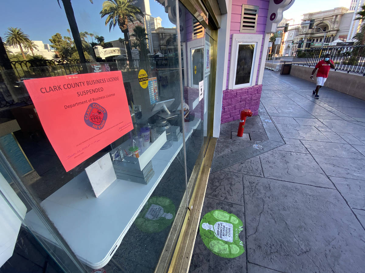 A Clark County sign states that the business license has been suspended at Fat Tuesday at Casin ...