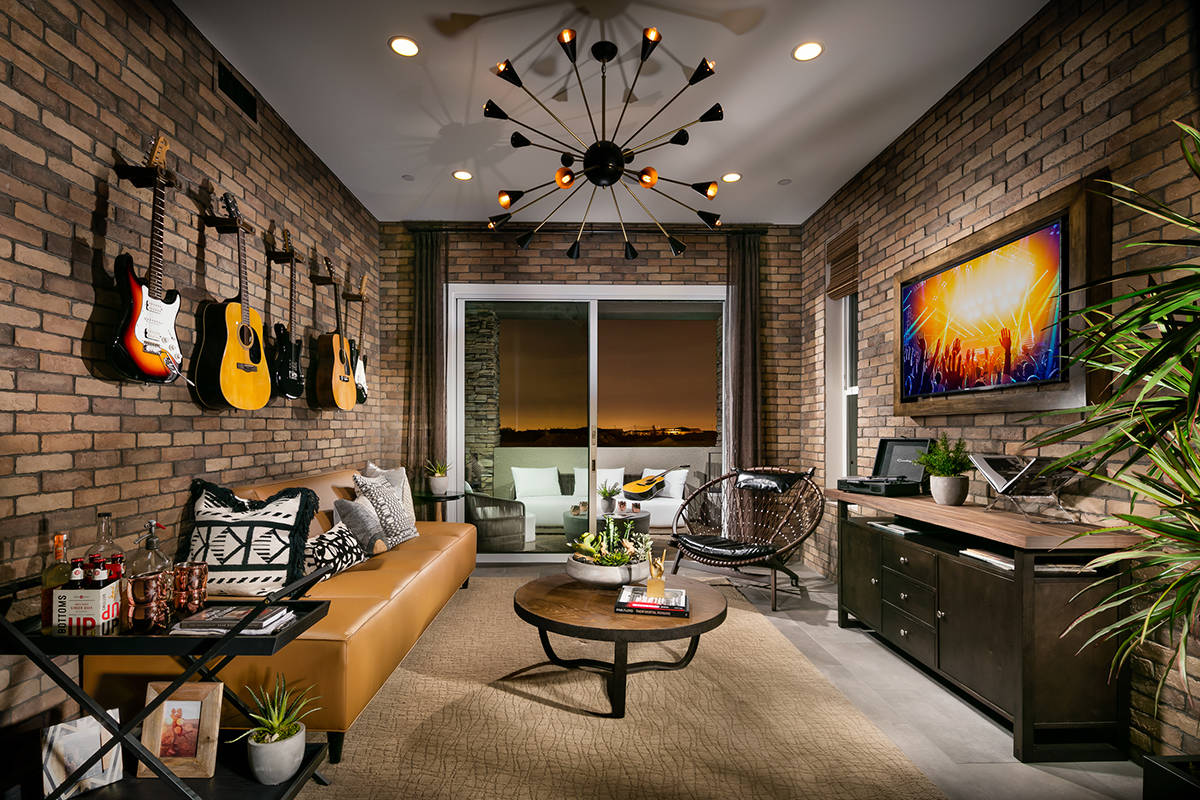 Toll Brothers turned this bonus room in its Fairway Hills new home model into a cool guitar lou ...