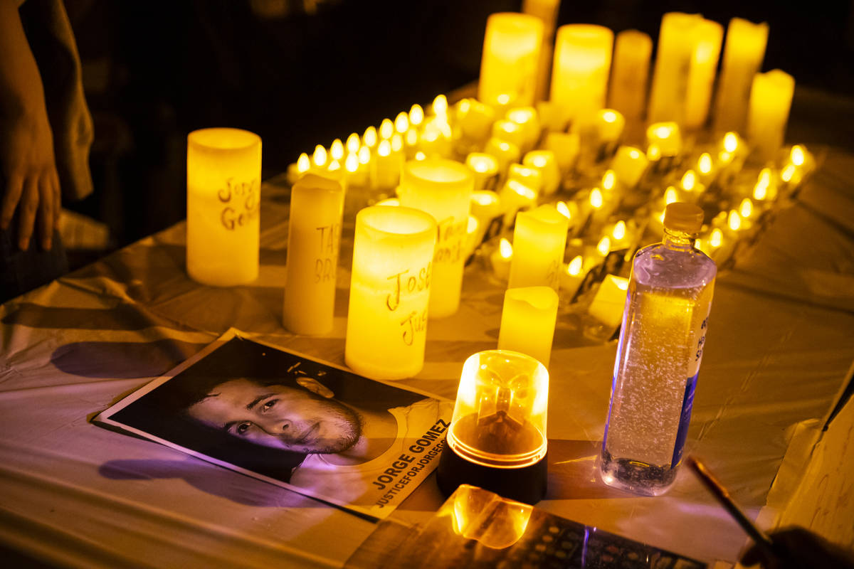 A photo of Jorge Gomez is seen at a candlelight vigil for Gomez and others who have died from p ...