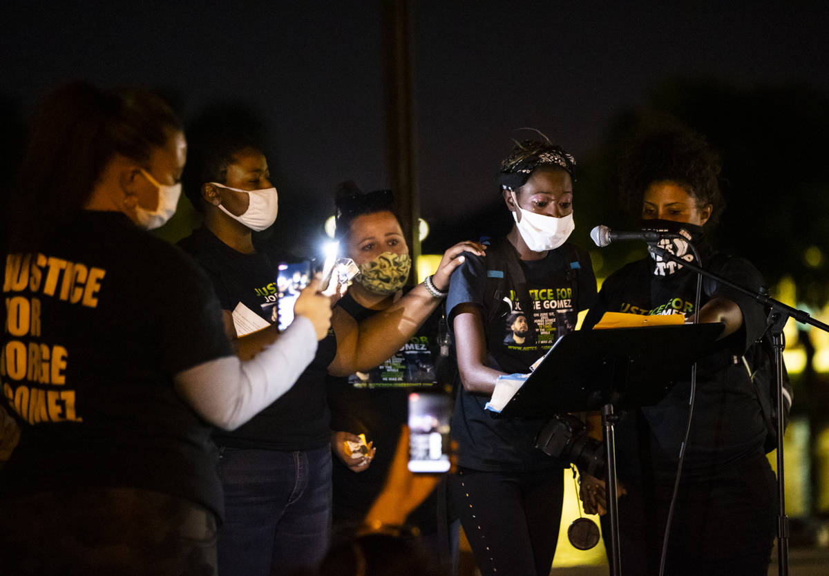 Teresa Brooks, right, speaks during a candlelight vigil for Jorge Gomez and others who have die ...