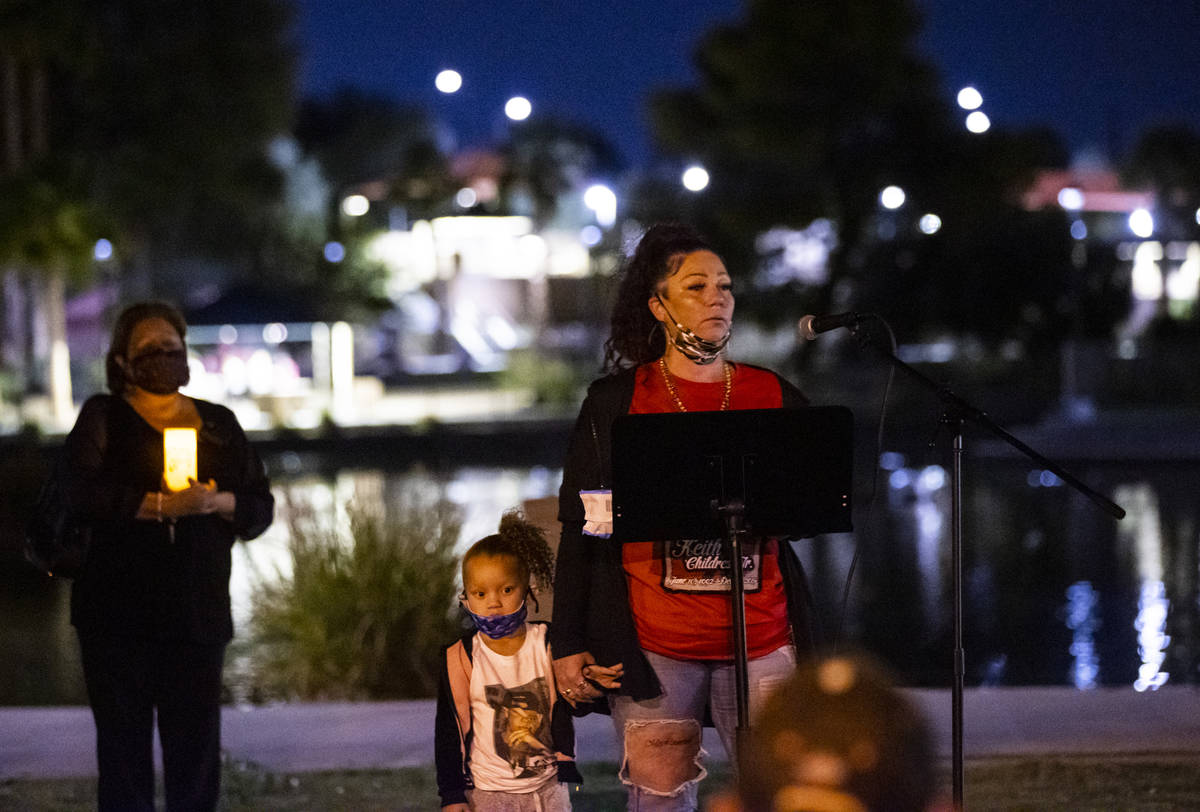 Jackie Lawrence, whose son, Keith Childress Jr., was killed by police, speaks during a candleli ...