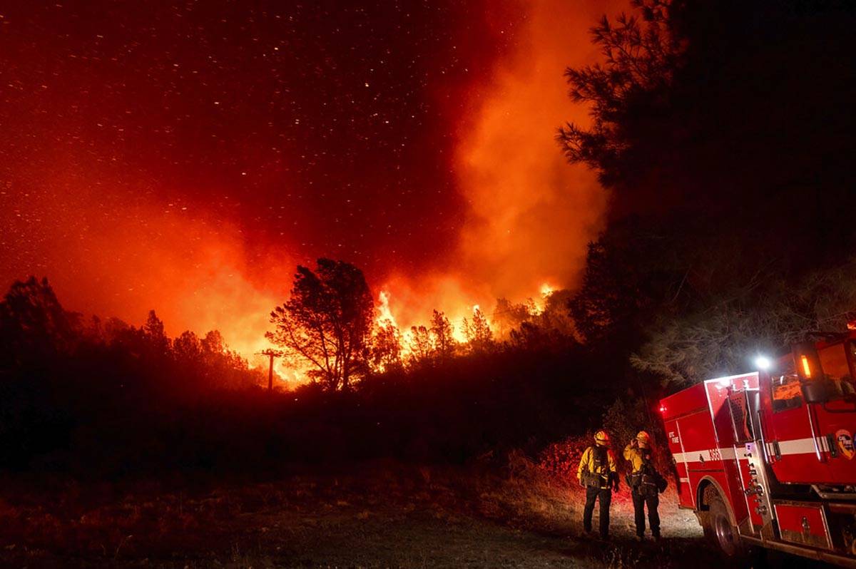 Firefighters watch the Bear Fire approach in Oroville, Calif., on Wednesday, Sept. 9, 2020. The ...