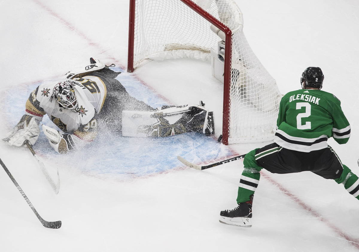 Dallas Stars defenseman Jamie Oleksiak (2) scores on Vegas Golden Knights goaltender Robin Lehn ...