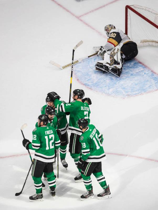 Dallas Stars celebrate a goal by Jamie Oleksiak as Vegas Golden Knights goalie Robin Lehner (90 ...