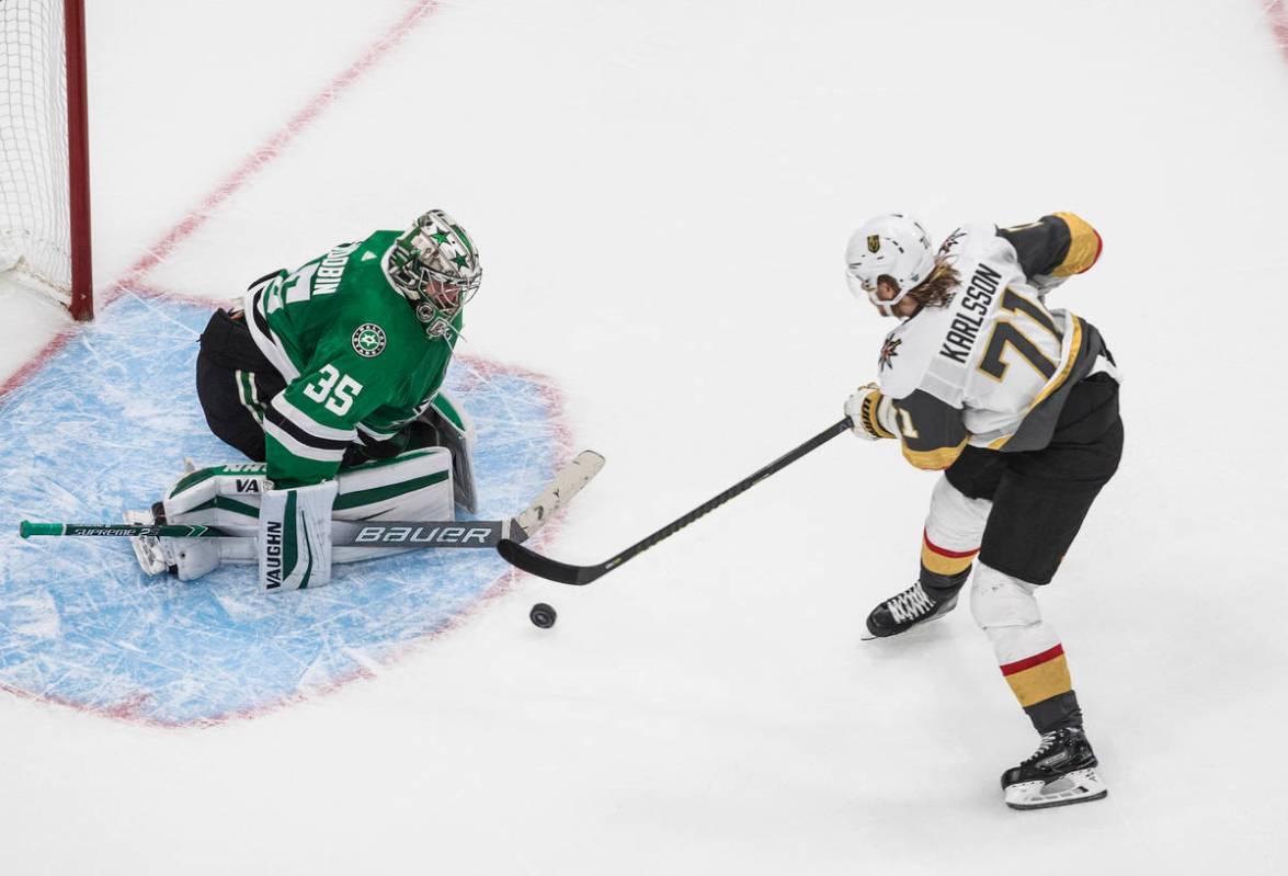 Dallas Stars goalie Anton Khudobin (35) makes a save on Vegas Golden Knights' William Karlsson ...