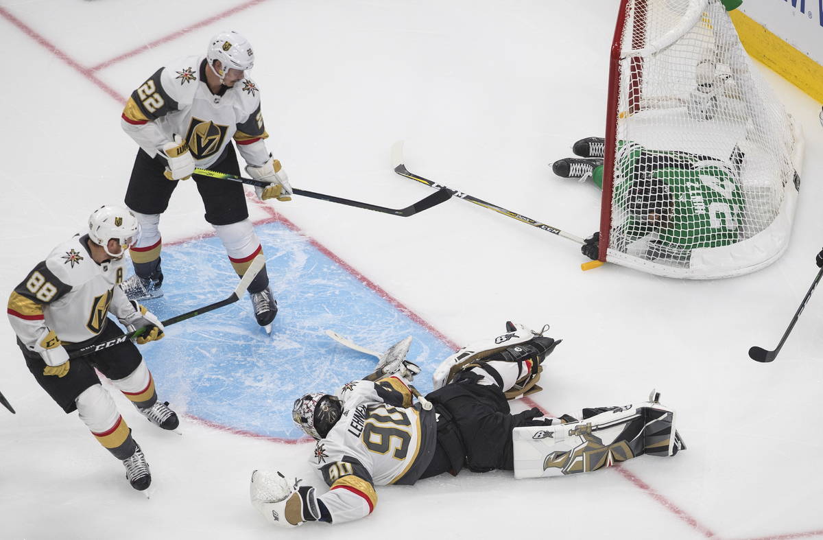 Dallas Stars' Roope Hintz (24) crashes into the net as Vegas Golden Knights goalie Robin Lehner ...
