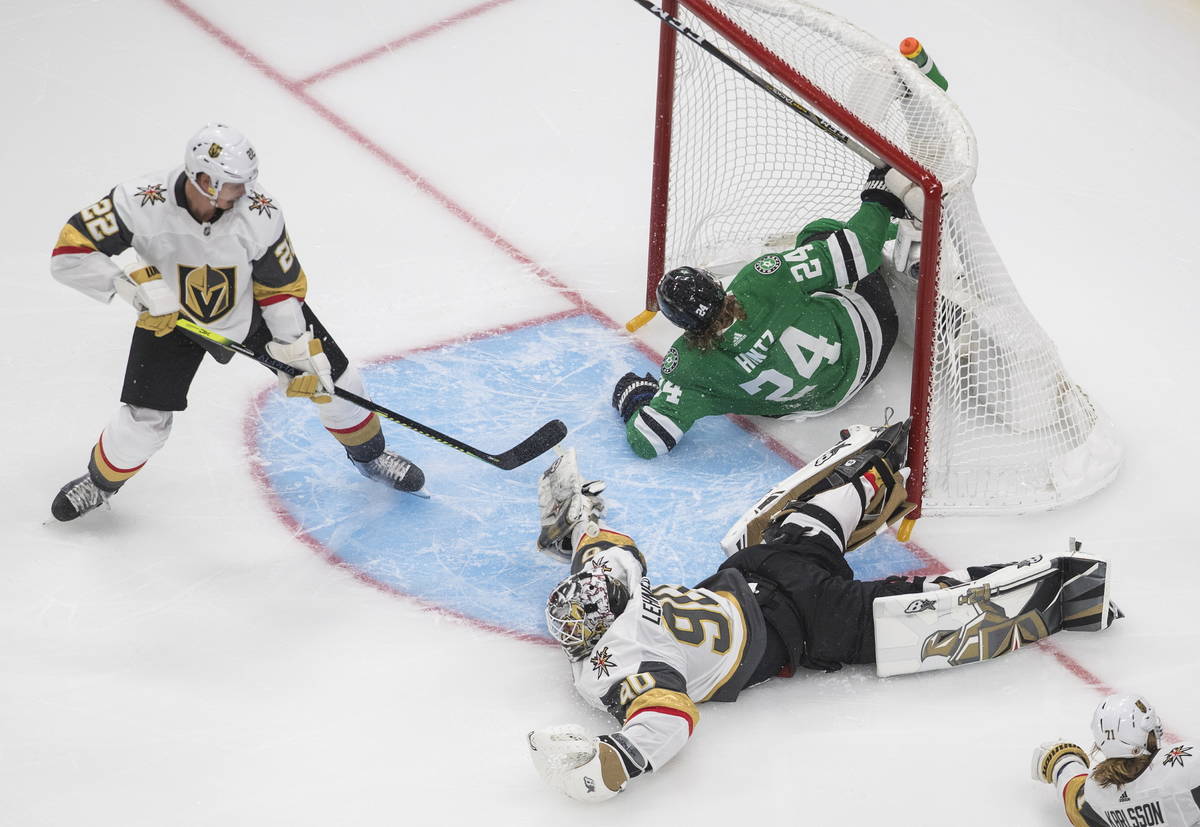 Dallas Stars' Roope Hintz (24) crashes into the net as Vegas Golden Knights goalie Robin Lehner ...