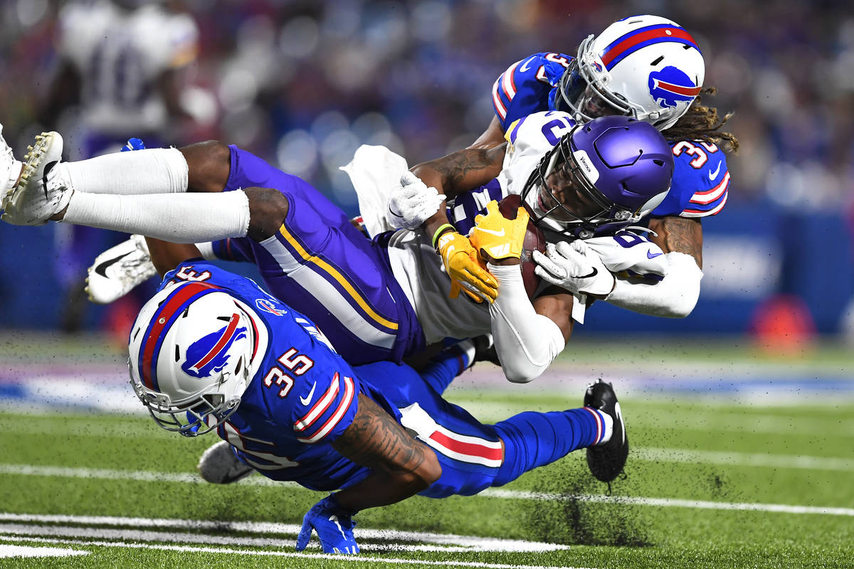 In this Aug. 29, 2019, file photo, Minnesota Vikings wide receiver Alexander Hollins, center, i ...