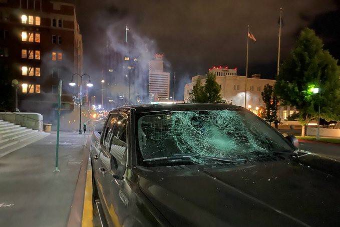 A damaged car is seen during a violent Black Lives Matter protest in downtown Reno on Saturday, ...