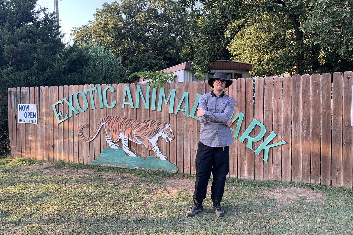 Zak Bagans is shown at the sign at the entrance Greater Wynnewood Exotic Animal Park on Saturda ...