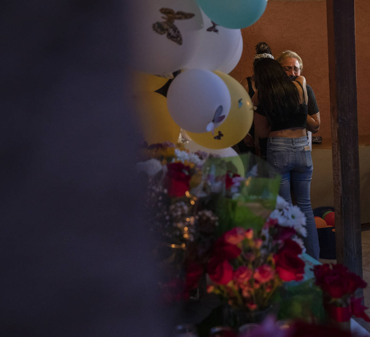 Mother of murder victim Lesly Palacio, Aracely Palacio, right, is comforted during a vigil for ...