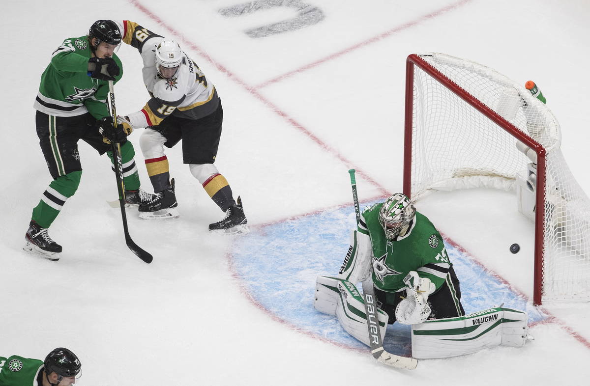 Dallas Stars goalie Anton Khudobin (35) makes a save as Vegas Golden Knights' Reilly Smith (19) ...