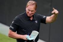 Las Vegas Raiders head coach Jon Gruden reacts during an NFL football training camp practice Fr ...