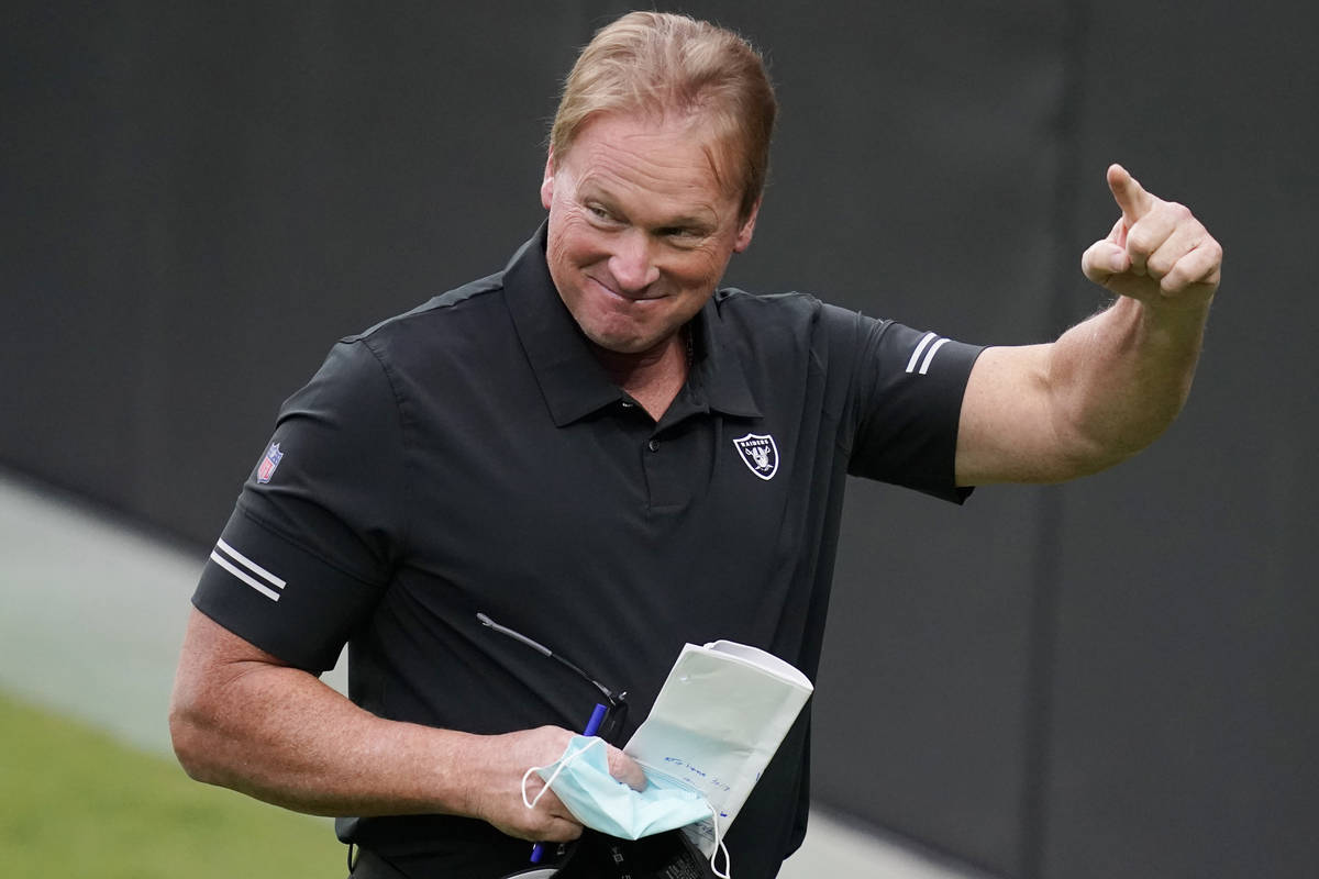 Las Vegas Raiders head coach Jon Gruden reacts during an NFL football training camp practice Fr ...