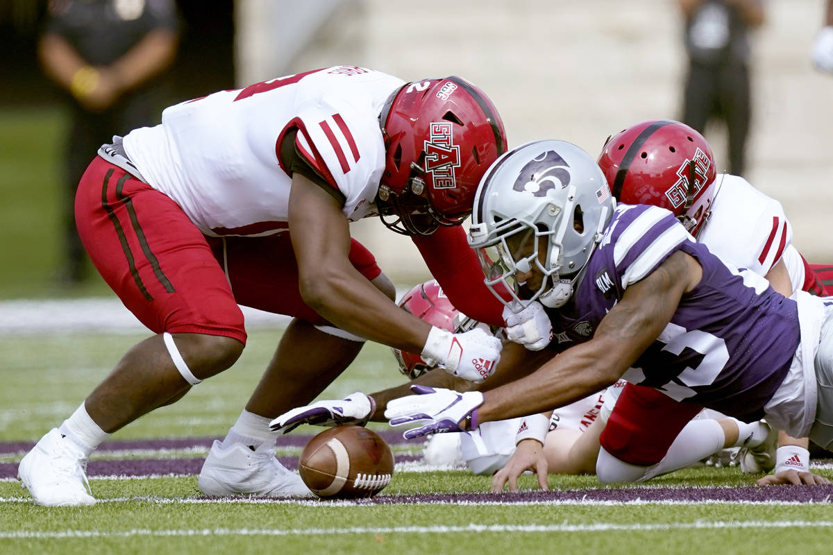 Kansas State defensive back D.J. Render (23) recovers an on-side kick during the first half of ...