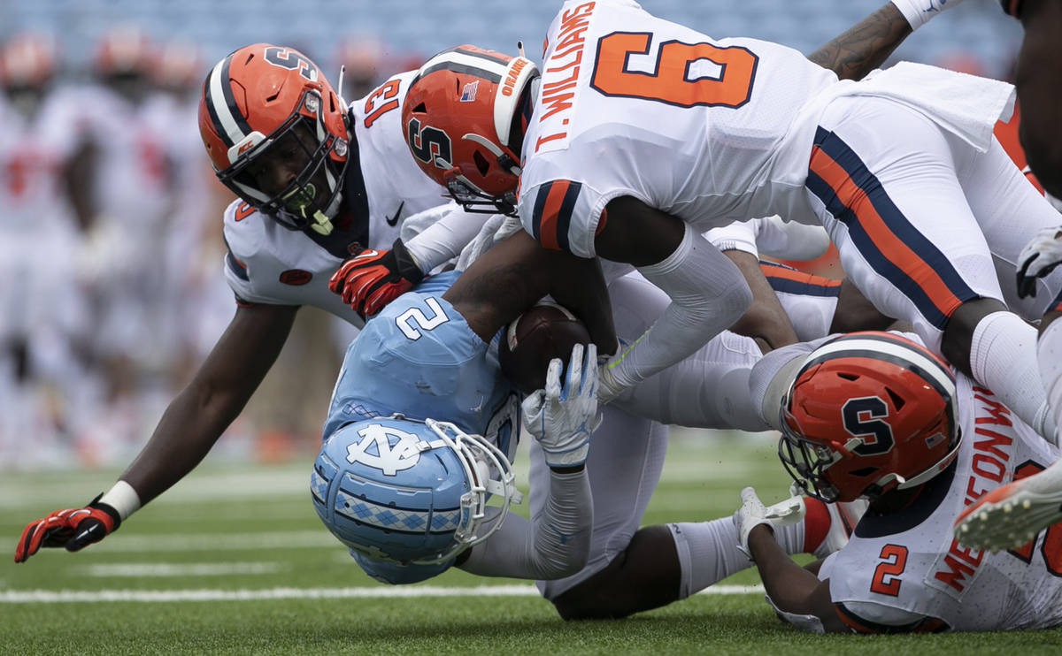 North Carolina's Dyami Brown (2) is stopped at the goal line after a 15-yard pass completion fr ...