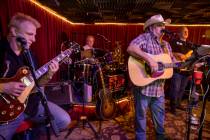 Owner Bobby Kingston, right, sings and plays with his band on the final night before Saddle N S ...