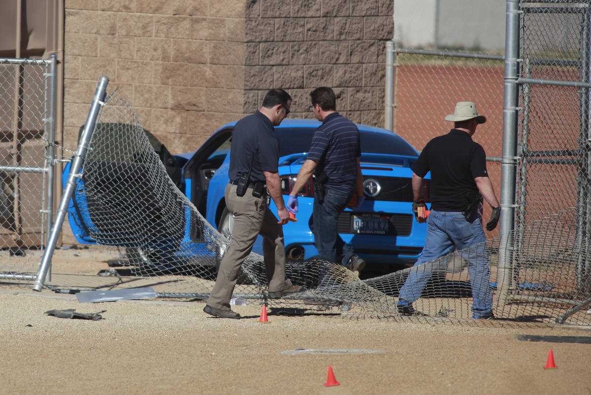 Las Vegas police investigate a suspected street-racing crash Feb. 9 involving two vehicles, one ...