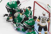 Dallas Stars goalie Anton Khudobin (35) makes a save against the Vegas Golden Knights as player ...