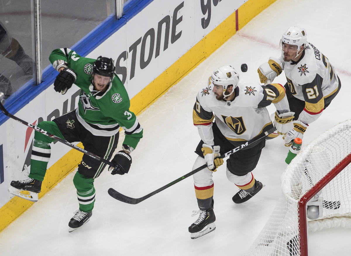 Dallas Stars' John Klingberg (3) and Vegas Golden Knights' Nicolas Roy (10) and Nick Cousins (2 ...