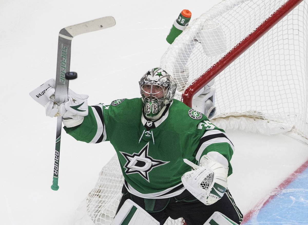Dallas Stars goalie Anton Khudobin bats the puck out of the air during the second period agains ...