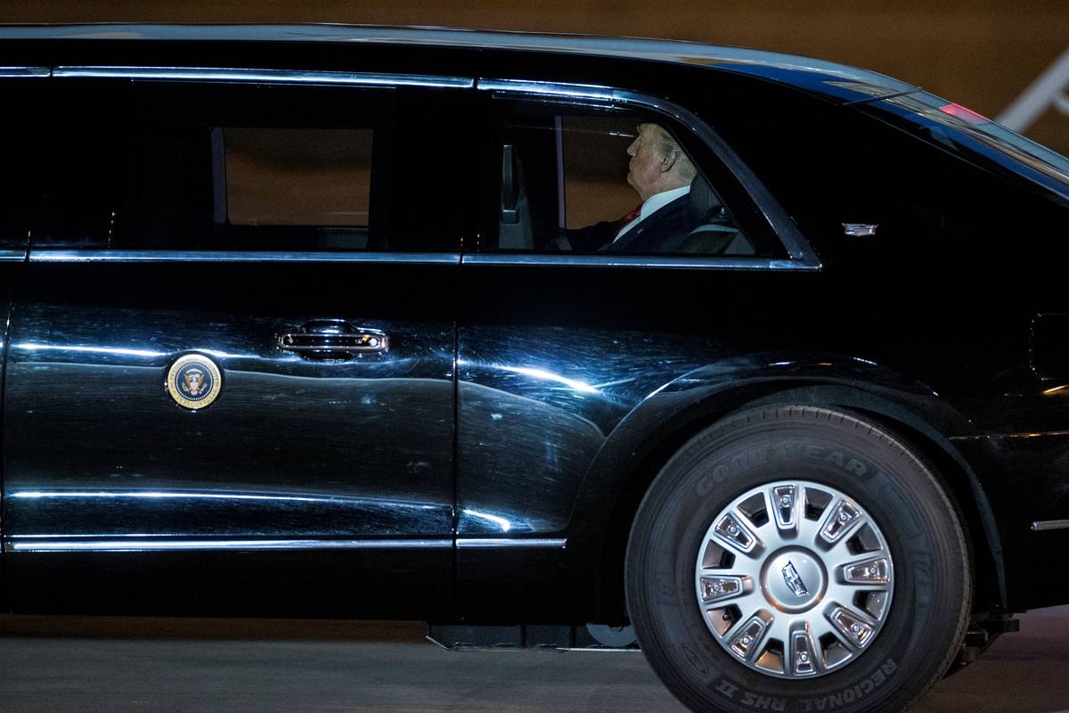 President Donald Trump sits in his limo after arriving at McCarran International Airport on Air ...