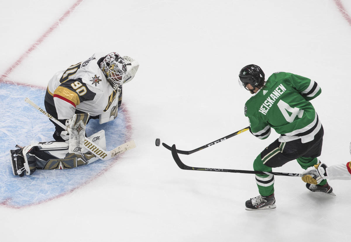 Dallas Stars' Miro Heiskanen (4) is stopped by Vegas Golden Knights goalie Robin Lehner (90) du ...