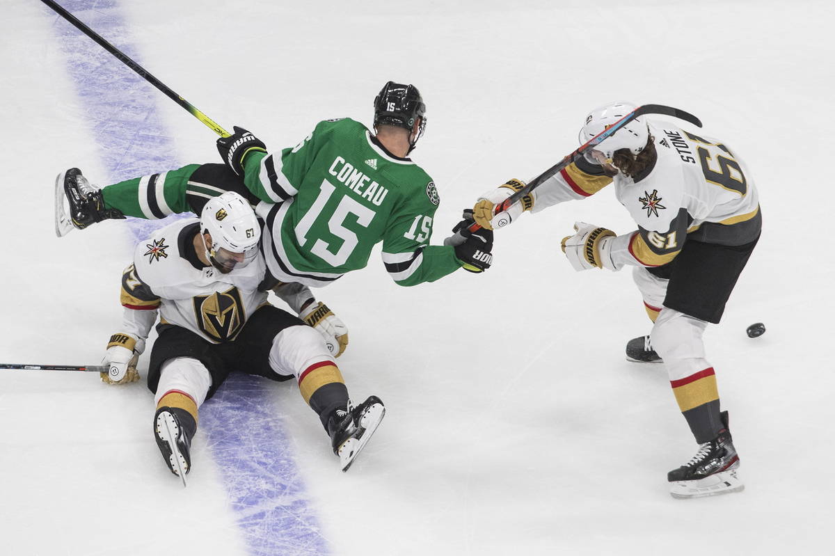 Dallas Stars' Blake Comeau (15) falls over Vegas Golden Knights' Max Pacioretty (67) as he grab ...