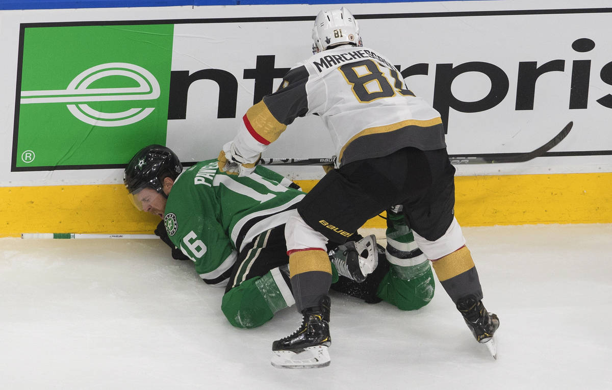 Dallas Stars' Joe Pavelski (16) is checked by Vegas Golden Knights' Jonathan Marchessault (81) ...