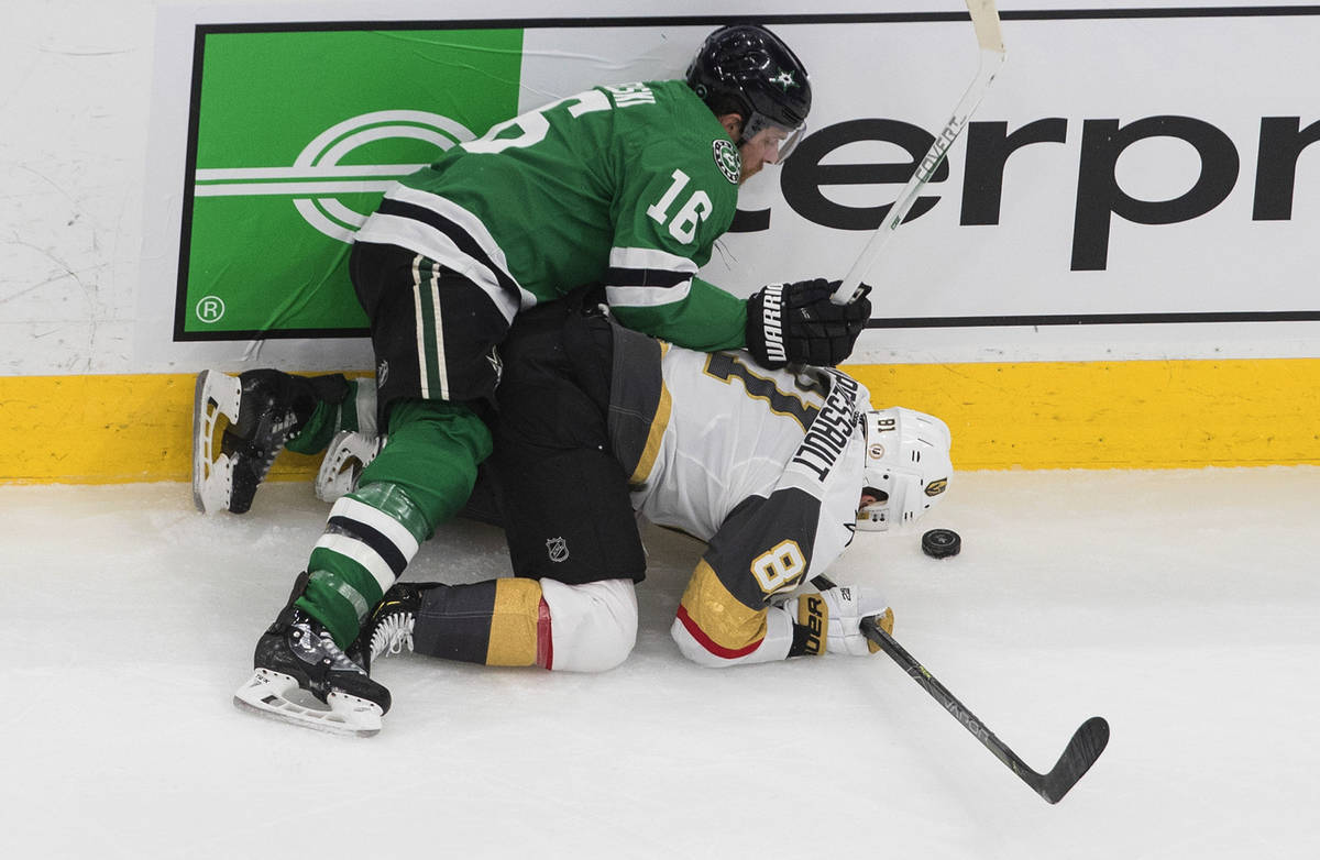 Dallas Stars' Joe Pavelski (16) checks Vegas Golden Knights' Jonathan Marchessault (81) during ...