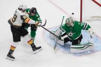 Dallas Stars goalie Anton Khudobin (35) makes a save on Vegas Golden Knights' Alex Tuch (89) as ...