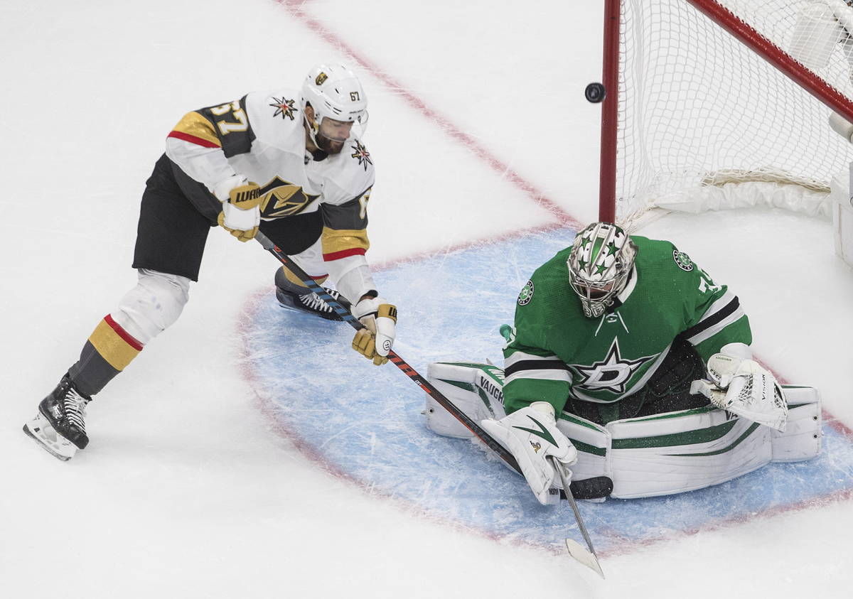 Dallas Stars goalie Anton Khudobin (35) makes a save on Vegas Golden Knights' Max Pacioretty (6 ...