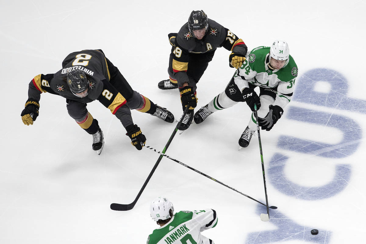 Dallas Stars' Denis Gurianov (34), Vegas Golden Knights' Reilly Smith (19) and Golden Knights' ...