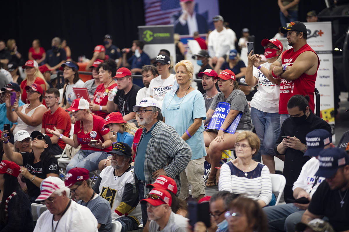 The crowd listens to President Donald Trump speak at a campaign rally at Xtreme Manufacturing i ...