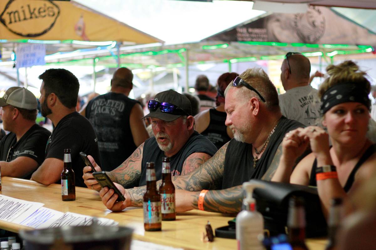 People congregate at One-Eyed Jack's Saloon during the 80th annual Sturgis Motorcycle Rally in ...
