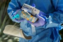 Nevada National Guard soldier PFC Nikolas Herrera carries tests and supplies during a walk-thru ...