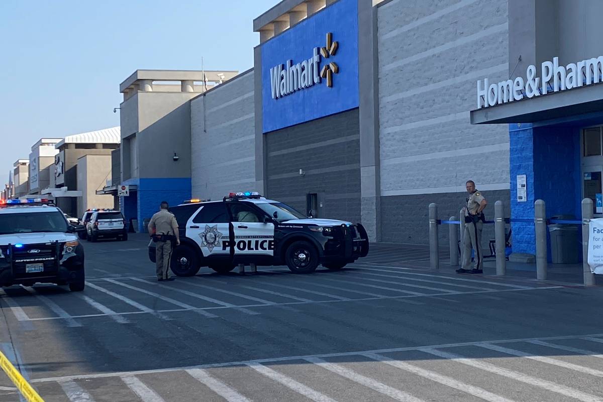 Police are seen outside a Walmart at 5200 South Fort Apache Road in Las Vegas on Monday, Sept. ...
