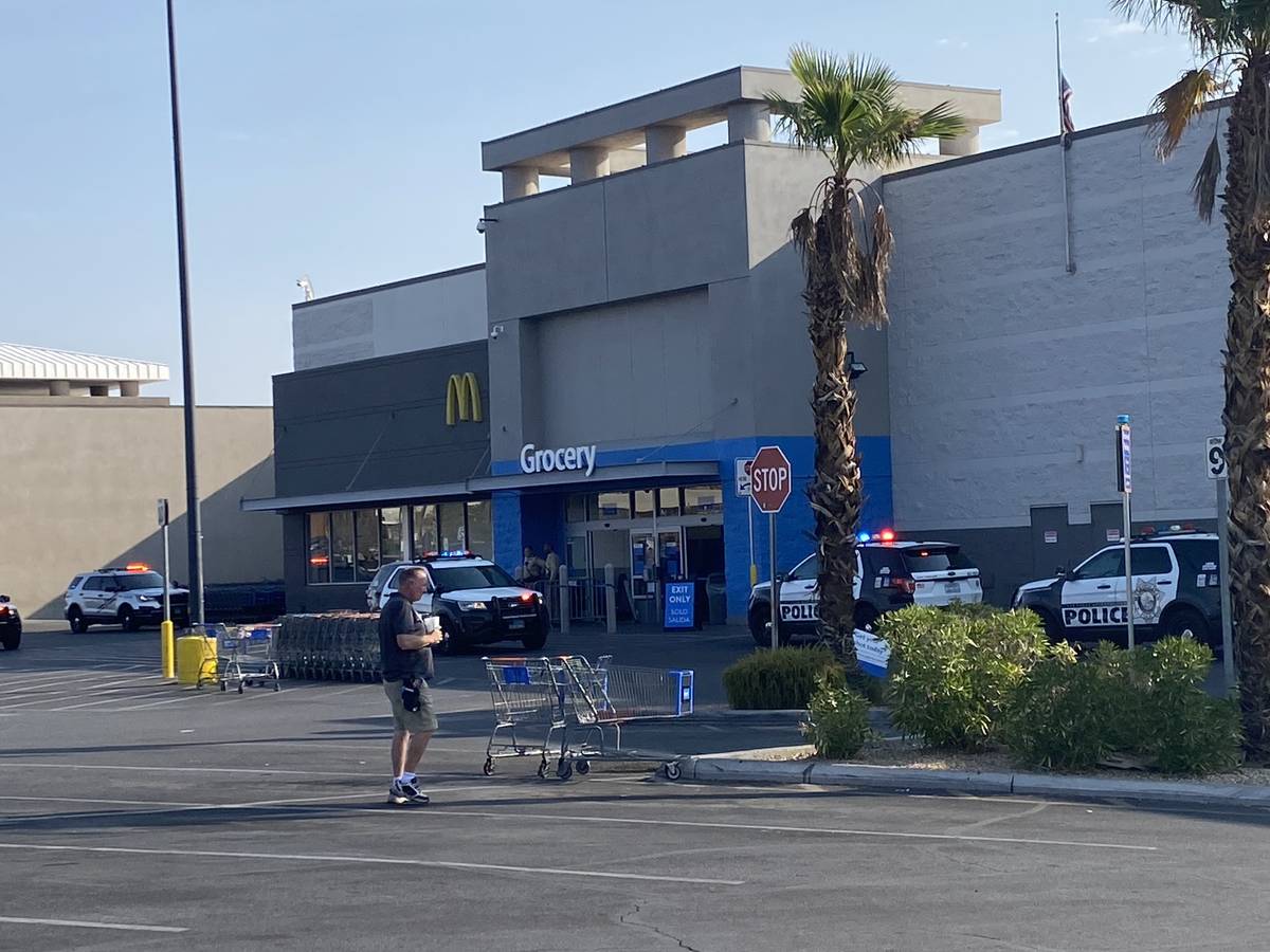 Police are seen outside a Walmart at 5200 South Fort Apache Road in Las Vegas on Monday, Sept. ...