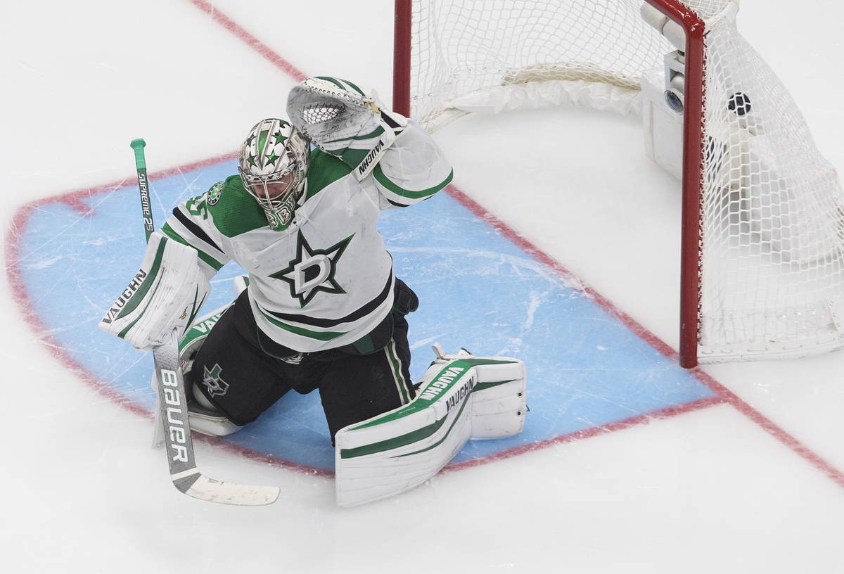 Dallas Stars goalie Anton Khudobin (35) is scored against by Vegas Golden Knights' Reilly Smith ...