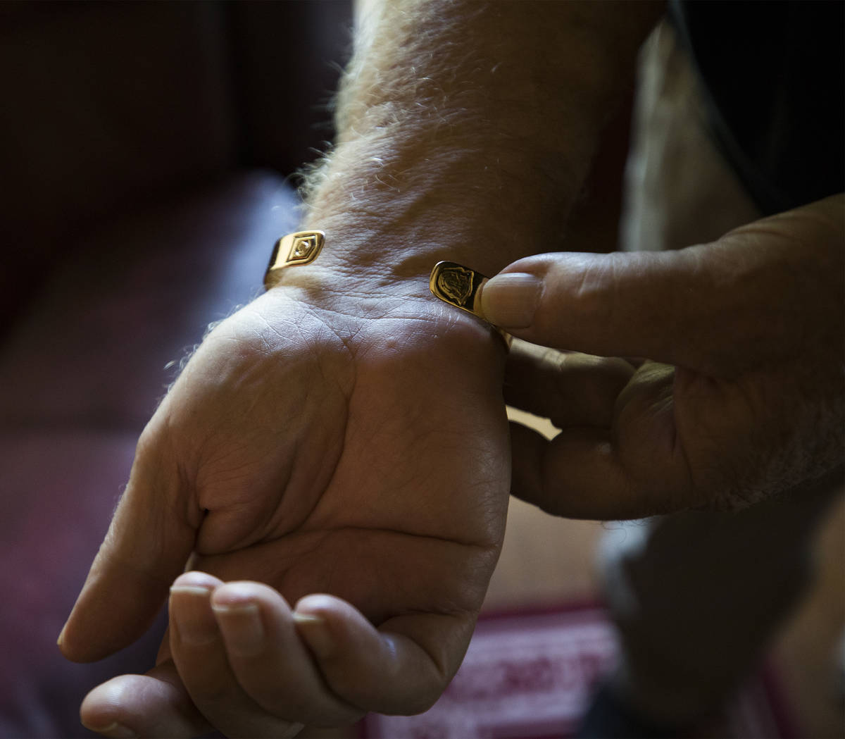James “Bo” Gritz, a former U.S. Army Special Forces officer, shows his POW/MIA bracelet at ...