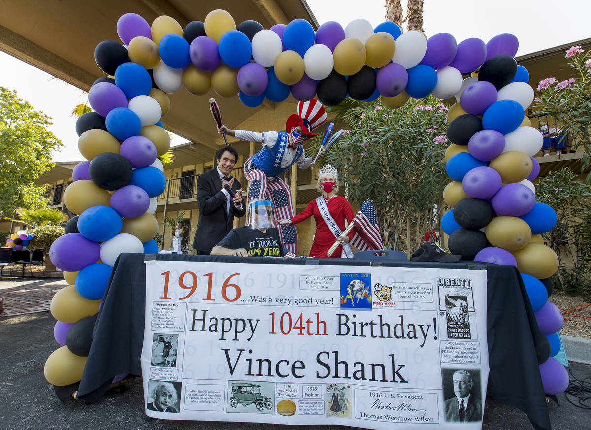 Vincent Shank, center, a World War II veteran and ex-POW turns 104 today and receives a birthda ...