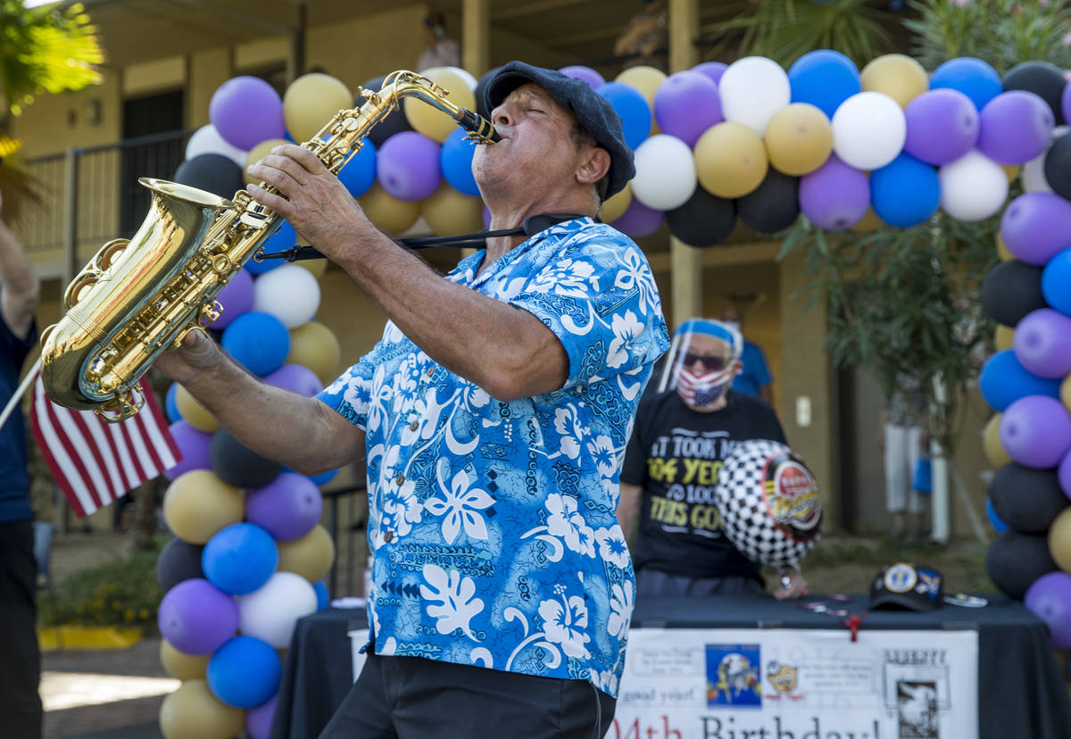 Martin Mancuso plays the sax during the celebration for Vincent Shank, a World War II veteran a ...