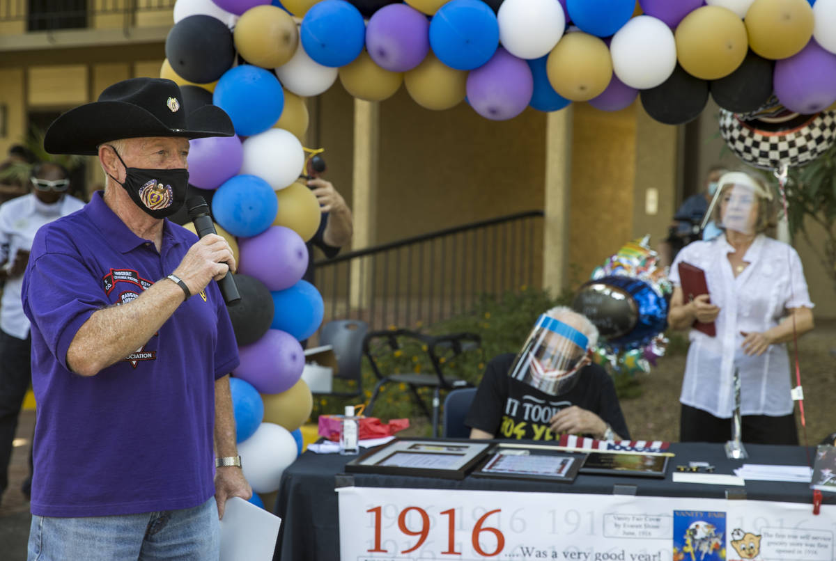 Richard Moyer, left, has some kind words for Vincent Shank, center, a World War II veteran and ...